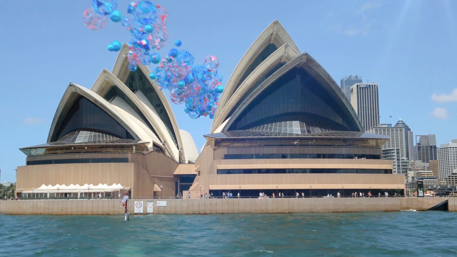 Live-action Sydney Opera House with motion graphics around it