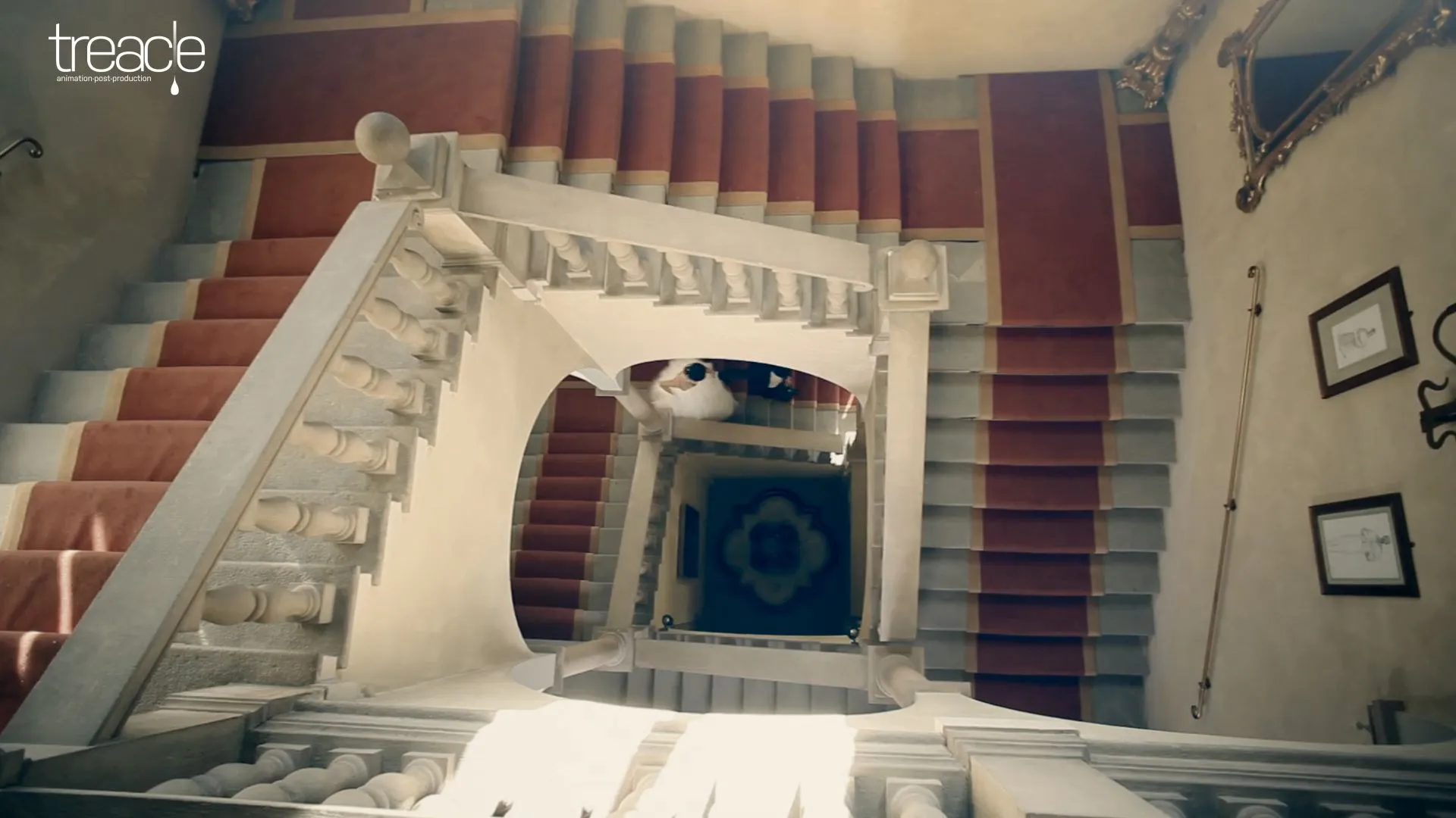 A birdseye view of a bridge and groom running down some stairs.