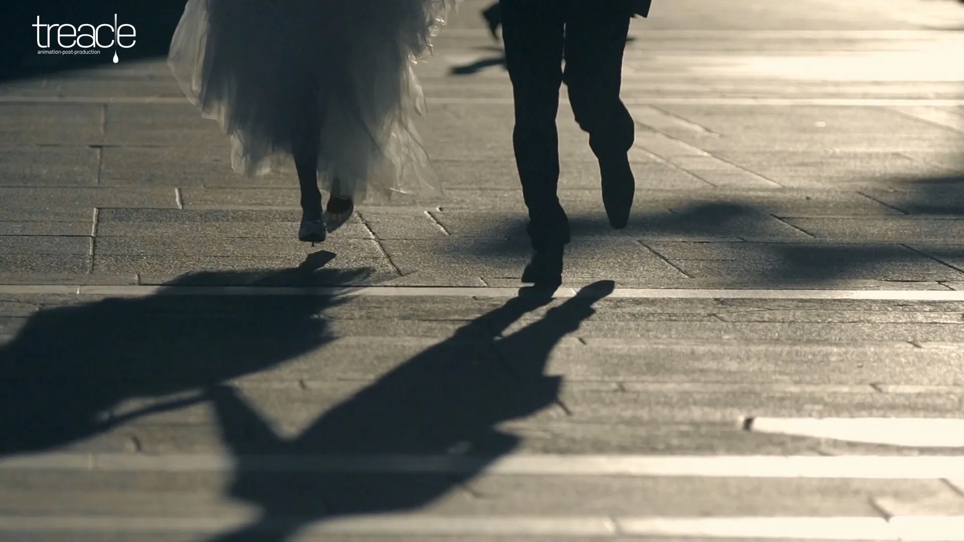 Close-up of the bridge and grooms legs as they run through Milan.