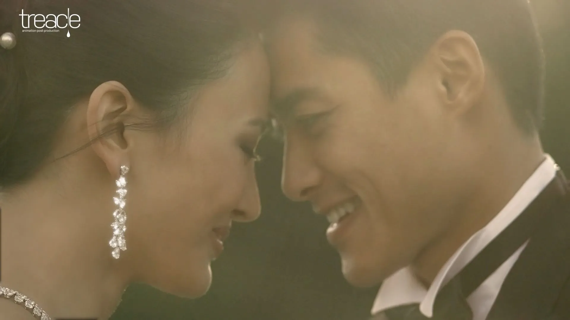 A bride and groom look lovingly into each other's eyes.